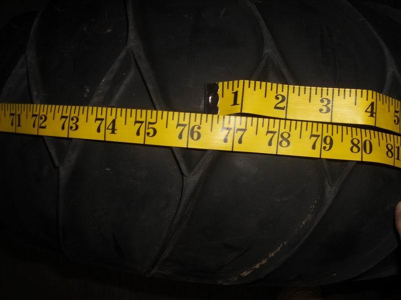 76.125 inch dia old rims and tires.jpg