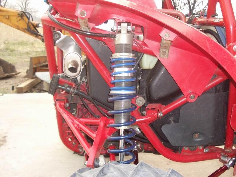 Side view of new shock and arm with shock back to stock locations hub moved back and out.jpg