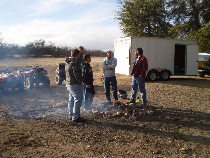 Keeping warm around the fire.JPG